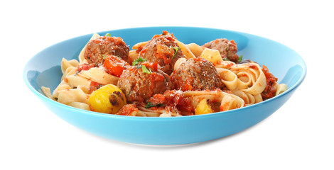 Delicious pasta with meat balls and tomato sauce in plate on white background