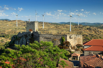 View of Sortelha castle, in Portugal, with wind turbine in background. - Vista do castelo de...