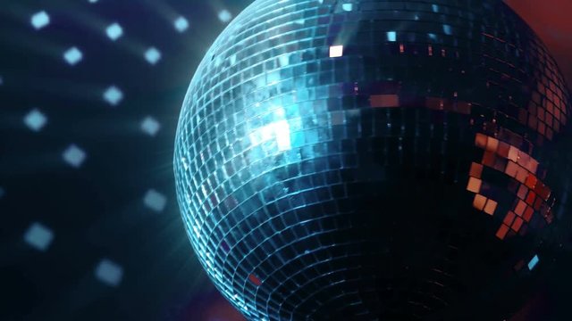 A Beautiful Shiny Spinning Disco Ball In Red Blue