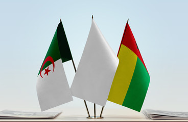 Flags of Algeria and Guinea-Bissau with a white flag in the middle