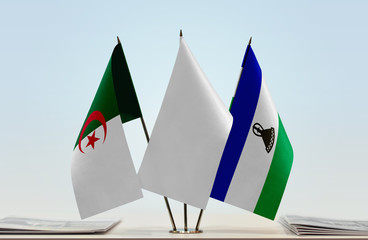 Flags of Algeria and Lesotho with a white flag in the middle