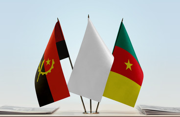 Flags of Angola and Cameroon with a white flag in the middle