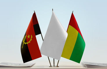 Flags of Angola and Guinea-Bissau with a white flag in the middle