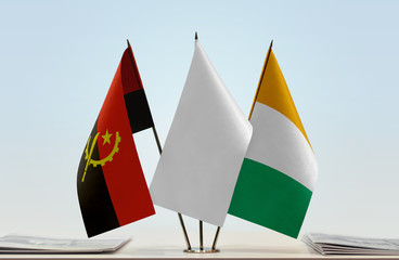 Flags of Angola and Ivory Coast with a white flag in the middle