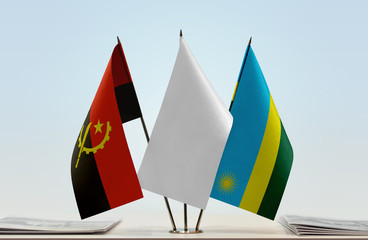 Flags of Angola and Rwanda with a white flag in the middle