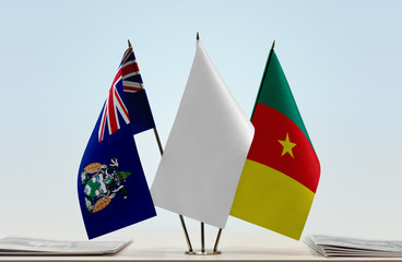 Flags of Ascension Island and Cameroon with a white flag in the middle