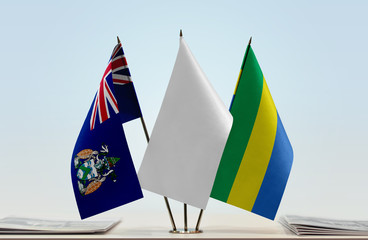 Flags of Ascension Island and Gabon with a white flag in the middle