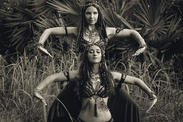 two beautiful tribal fusion belly dancers outdoors
