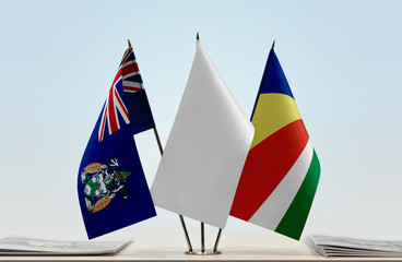 Flags of Ascension Island and Seychelles with a white flag in the middle