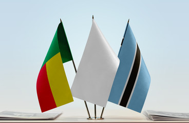 Flags of Benin and Botswana with a white flag in the middle