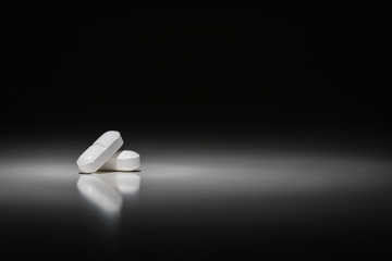Hydrocodone Prescription Pills Under Spot Light.