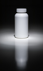Blank White Bottle Ready For Your Text Under Spot Light.