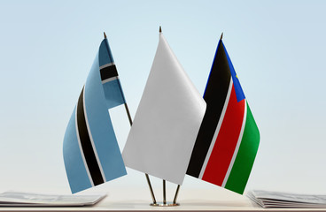 Flags of Botswana and South Sudan with a white flag in the middle