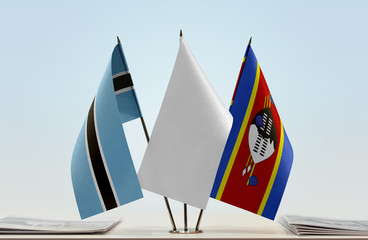Flags of Botswana and Swaziland with a white flag in the middle