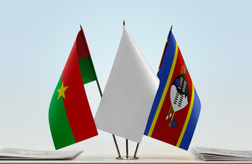 Flags of Burkina Faso and Swaziland with a white flag in the middle