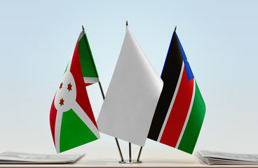 Flags of Burundi and South Sudan with a white flag in the middle