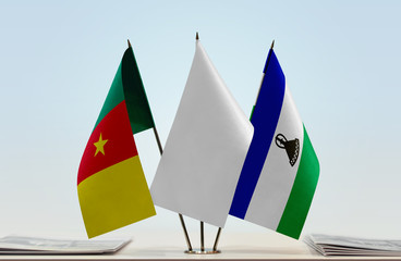 Flags of Cameroon and Lesotho with a white flag in the middle