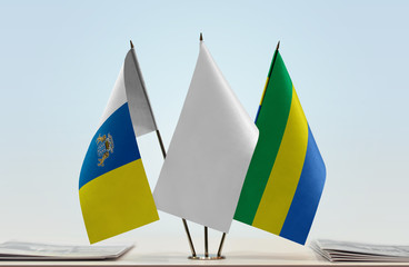 Flags of Canary Islands and Gabon with a white flag in the middle