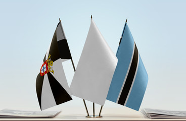 Flags of Ceuta and Botswana with a white flag in the middle