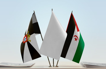 Flags of Ceuta and Sahrawi Arab Democratic Republic with a white flag in the middle