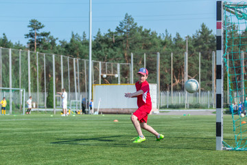 oh, no! it's a goal! kid goalkeeper misses a ball during a football match