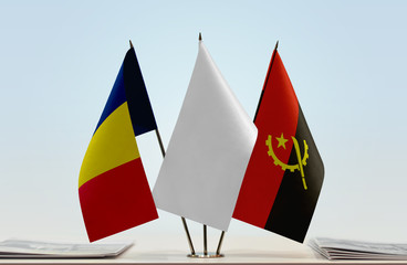 Flags of Chad and Angola with a white flag in the middle