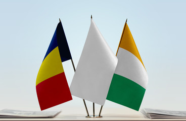 Flags of Chad and Ivory Coast with a white flag in the middle