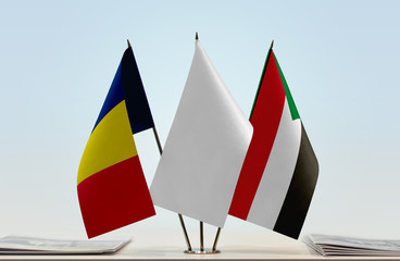 Flags of Chad and Sudan with a white flag in the middle