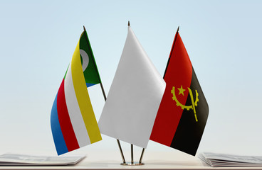 Flags of Comoros and Angola with a white flag in the middle