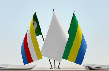 Flags of Comoros and Gabon with a white flag in the middle