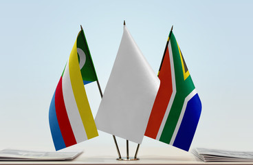 Flags of Comoros and Republic of South Africa with a white flag in the middle