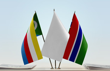 Flags of Comoros and The Gambia with a white flag in the middle