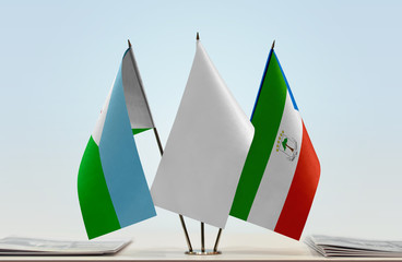 Flags of Djibouti and Equatorial Guinea with a white flag in the middle