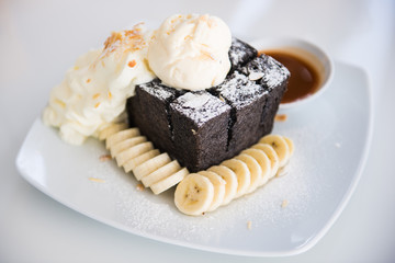 Charcoal toast with ice-cream, fresh banana and whipped cream