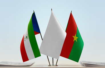 Flags of Equatorial Guinea and Burkina Faso with a white flag in the middle