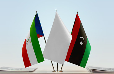 Flags of Equatorial Guinea and Libya with a white flag in the middle