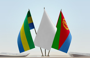 Flags of Gabon and Eritrea with a white flag in the middle