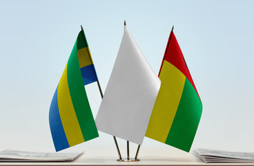 Flags of Gabon and Guinea-Bissau with a white flag in the middle