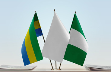 Flags of Gabon and Nigeria with a white flag in the middle
