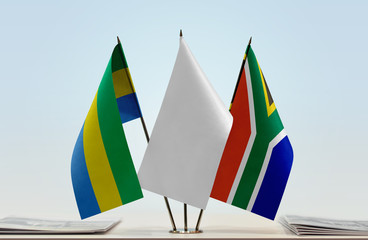 Flags of Gabon and Republic of South Africa with a white flag in the middle