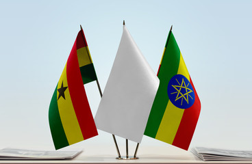 Flags of Ghana and Ethiopia with a white flag in the middle