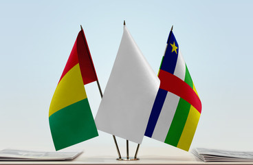 Flags of Guinea and Central African Republic with a white flag in the middle