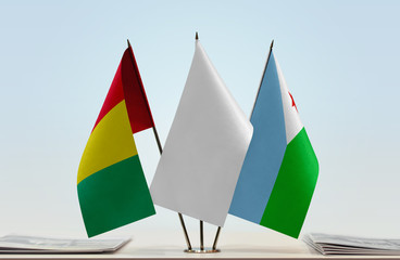 Flags of Guinea and Djibouti with a white flag in the middle