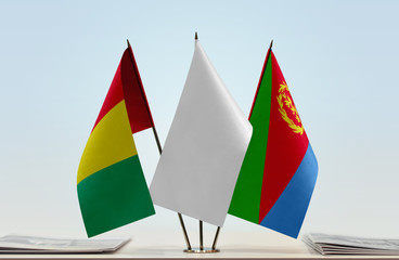 Flags of Guinea and Eritrea with a white flag in the middle