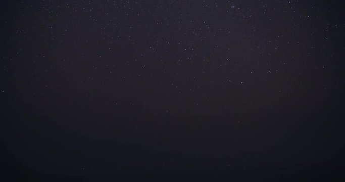 night sky over misty mountain time lapse shot
