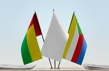 Flags of Guinea-Bissau and Comoros with a white flag in the middle