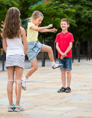 Kids playing with chinese jumping rope