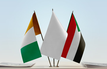 Flags of Ivory Coast and Sudan with a white flag in the middle