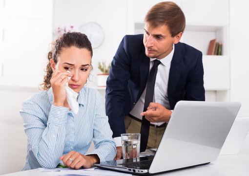 irritable boss man accusing crying woman to making mistake