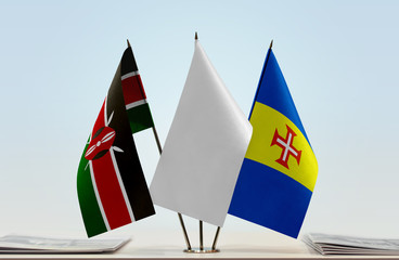 Flags of Kenya and Madeira with a white flag in the middle